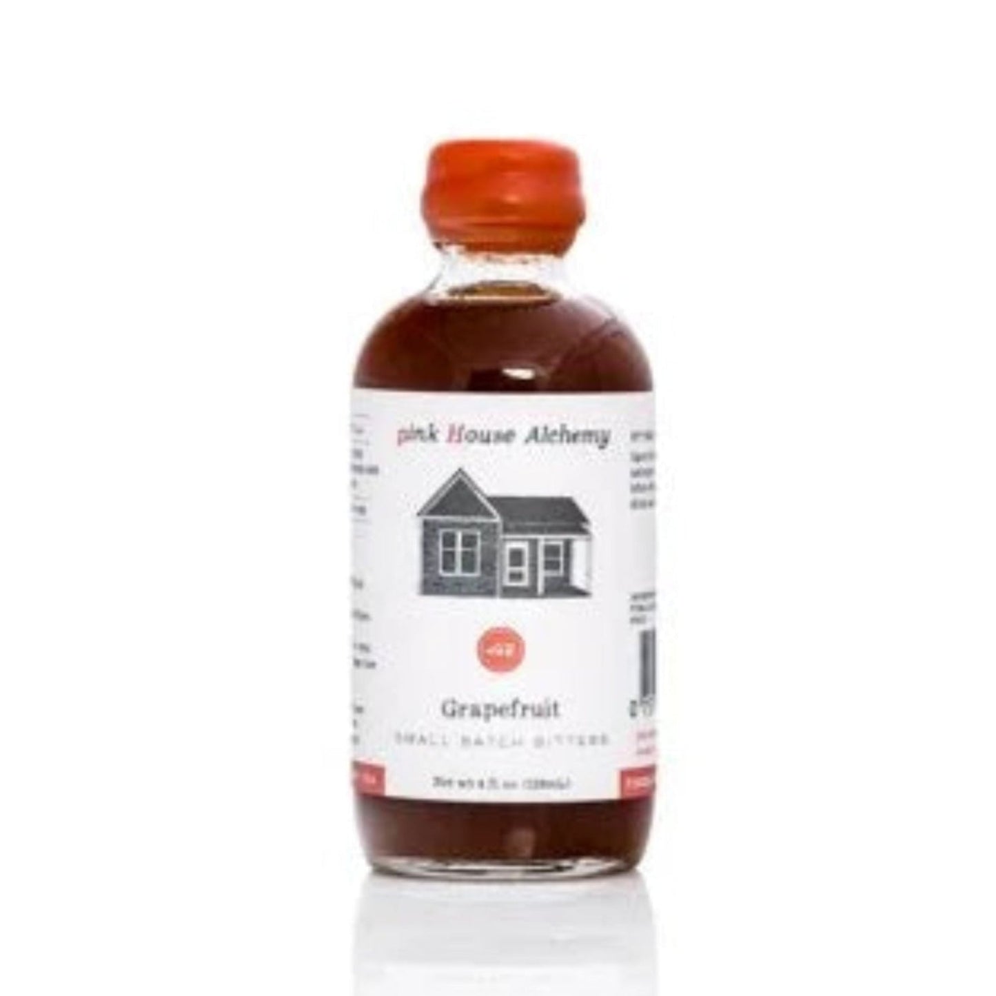 Bottle of grapefruit liqueur with a white label on a white background